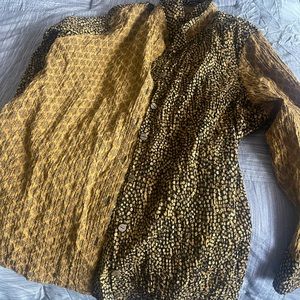 Button up shirt. New with tags. Runs small. Actually like an xl